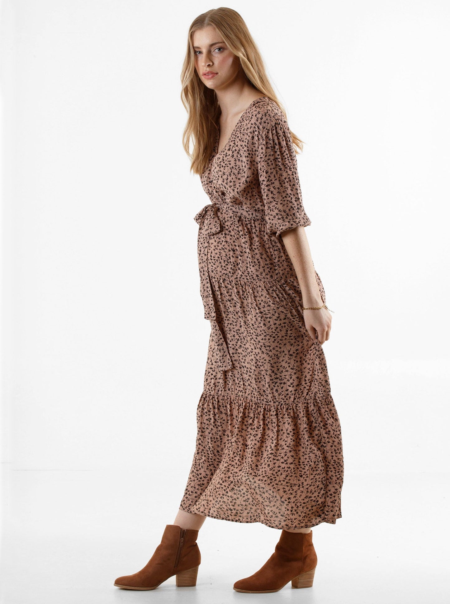 A woman in black leaf print angel maternity dana maternity midi dress, side (6651645657191)