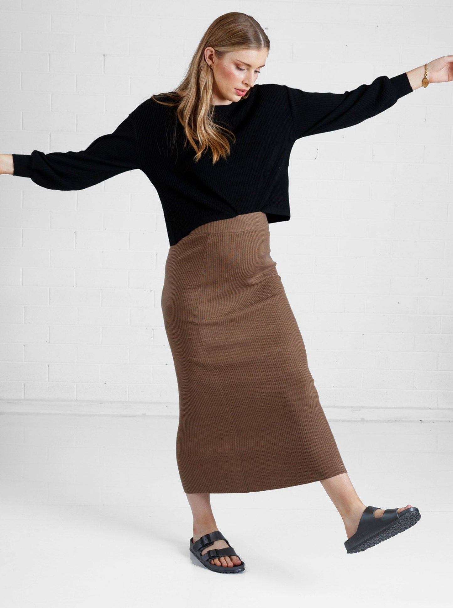 a woman in brown maternity angel maternity wool blend knit skirt with side split, full looks (6651643461735)