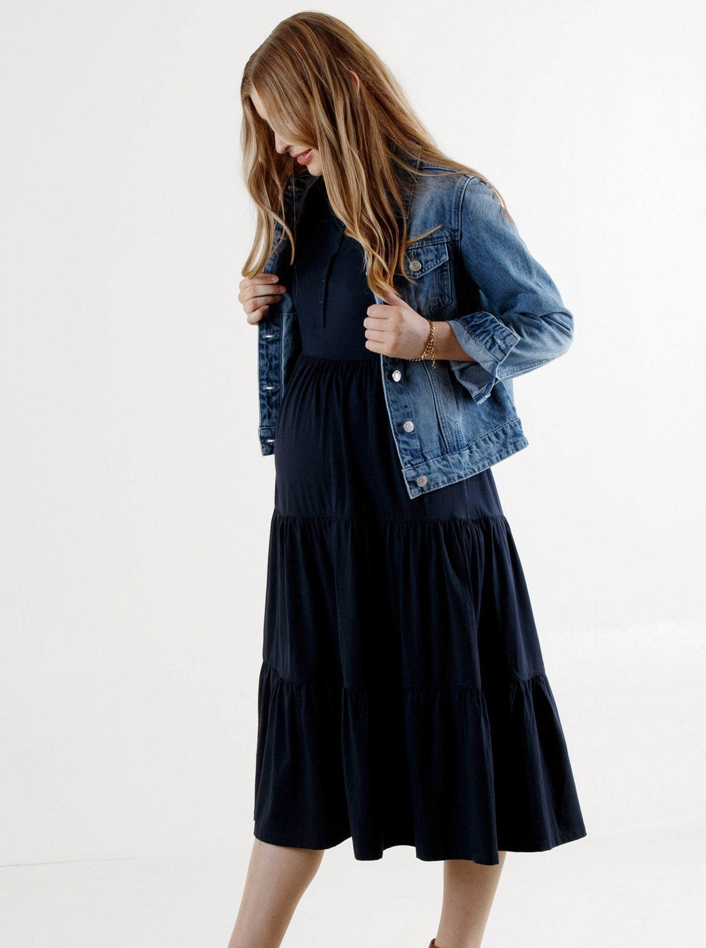 a woman in navy essential maternity tiered midi dress & jacket (6653086531687)