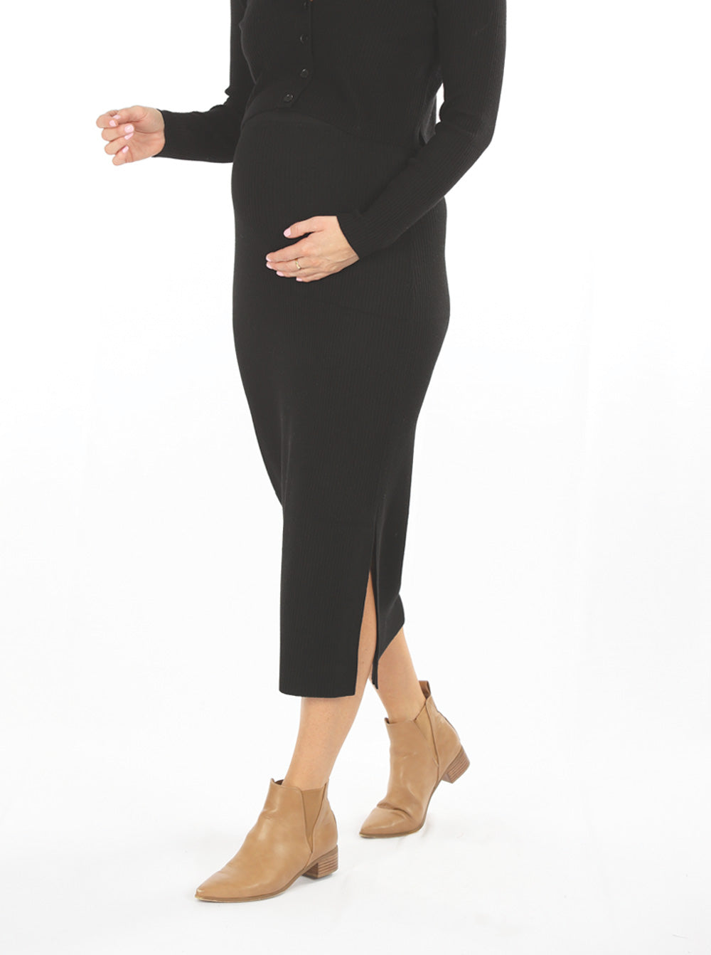 A woman in black wool blend knit maternity side split skirt, side2 (6588163948647)